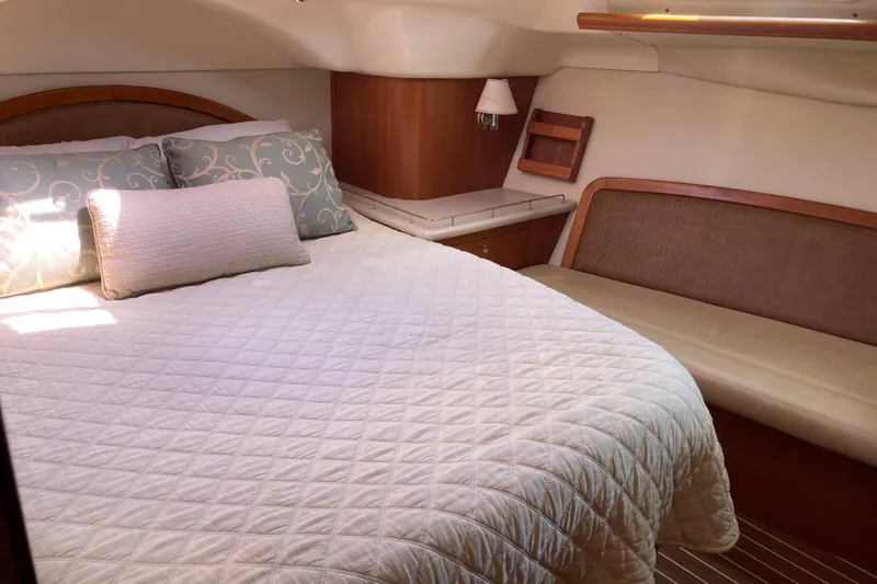 Slide: The Image of Luxurious cabin interior of 2006 Hunter 45 CC yacht with cozy bedding and seating. - 4