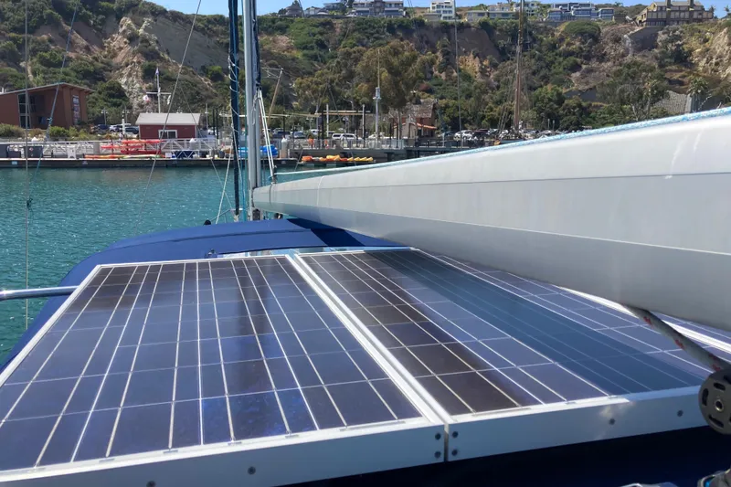 Slide: The Image of Sailboat with solar panels docked in a marina, Hunter 45 CC, 2006 model. - 47