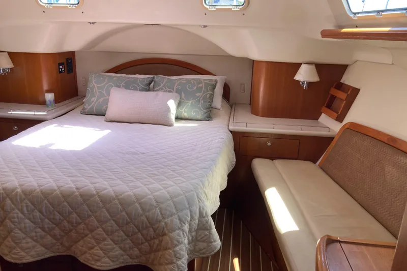 Slide: The Image of Luxurious cabin interior of 2006 Hunter 45 CC yacht with cozy bed and seating. - 5