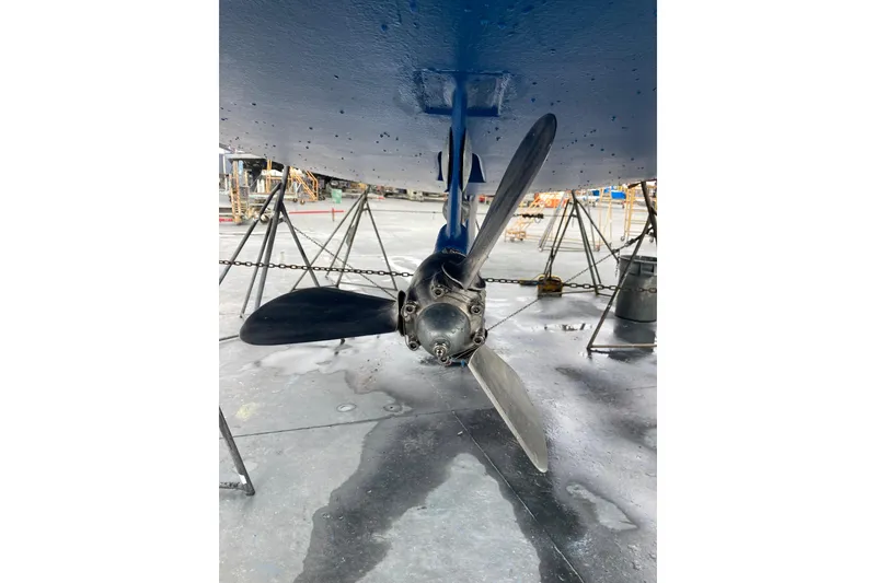 Slide: The Image of Propeller of 2006 Hunter 45 CC sailboat in dry dock, viewed from below. - 54