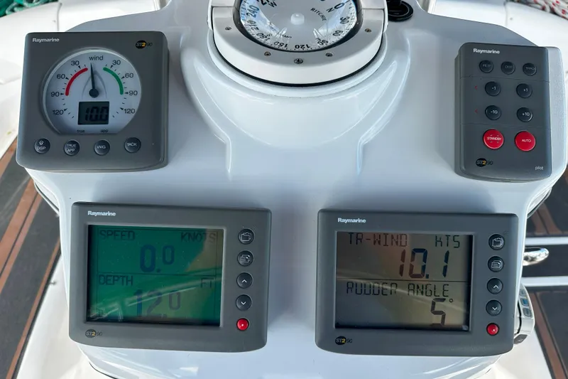 Slide: The Image of Control panel of a 2006 Hunter 45 CC sailboat with Raymarine instruments. - 56