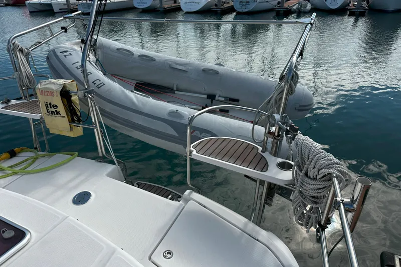 Slide: The Image of Hunter 45 CC yacht, 2006 model, with dinghy and safety equipment at marina. - 63