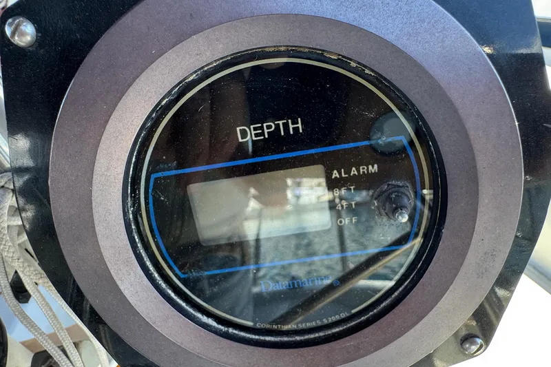 Slide: The Image of Depth gauge on 1989 Ericson Sloop, displaying alarm settings for 8ft, 4ft, and off. - 13