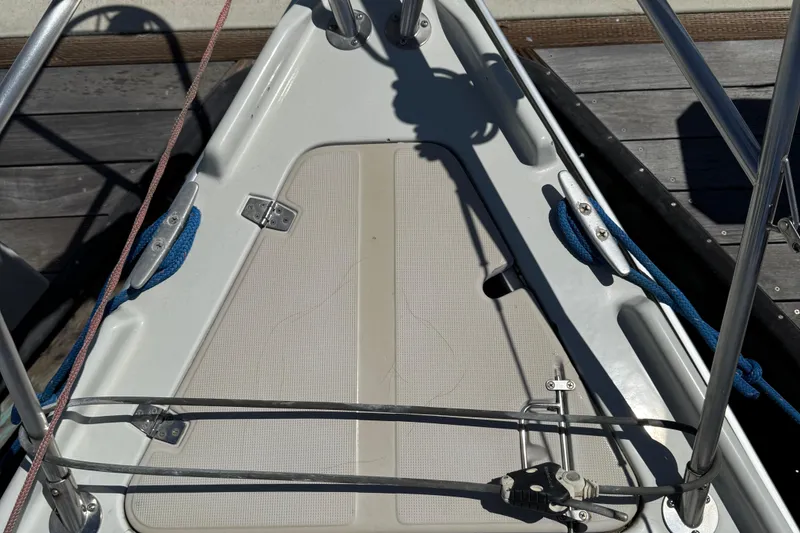 Slide: The Image of Bow of 1989 Ericson Sloop with ropes and deck fittings in sunlight. - 17