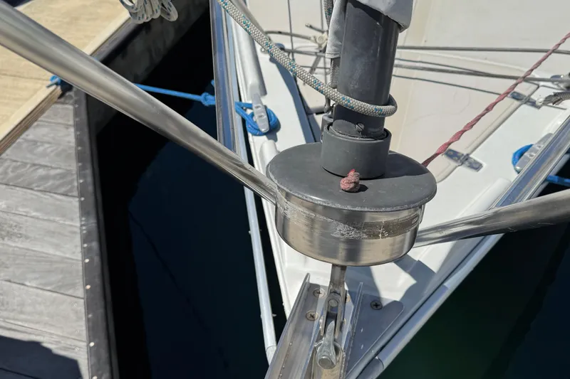 Slide: The Image of Close-up of 1989 Ericson Sloop's deck hardware and rigging at a marina. - 18