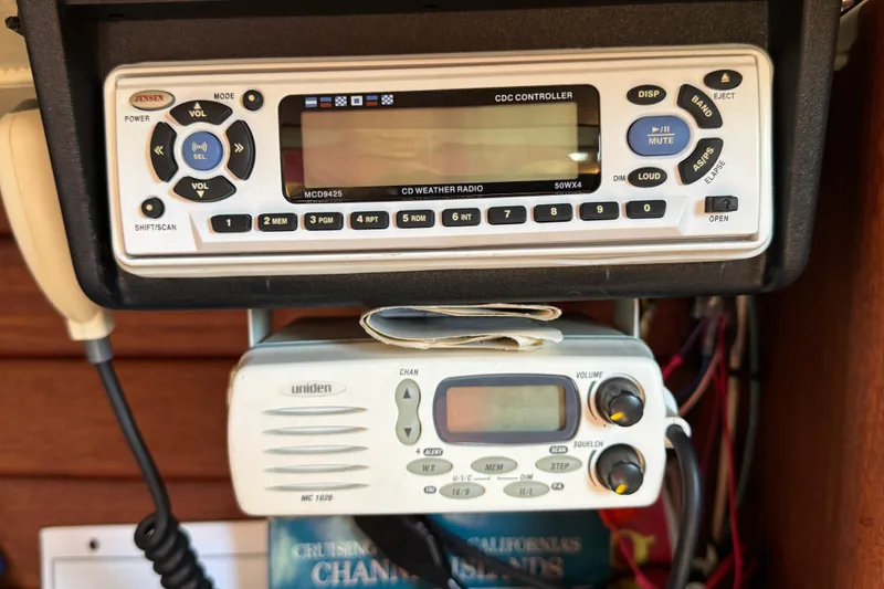 Slide: The Image of Control panel with Jensen and Uniden radios on a 1989 Ericson Sloop. - 32