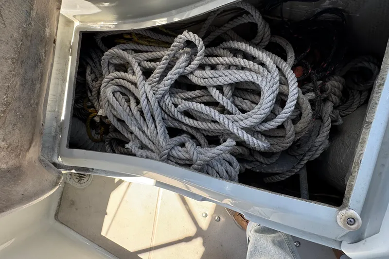 Slide: The Image of Coiled ropes in storage compartment of 1989 Ericson Sloop sailboat. - 8
