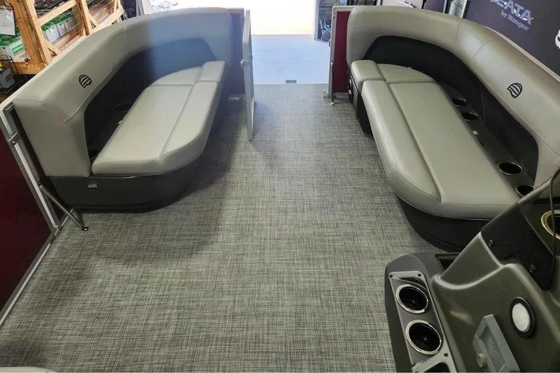 Slide: The Image of Interior of 2026 Sun Tracker Party Barge 16 DLX with gray seating and cup holders. - 5