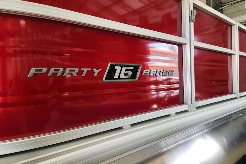 Slide: The Image of 2026 Sun Tracker Party Barge 16 DLX, red exterior detail. - 6