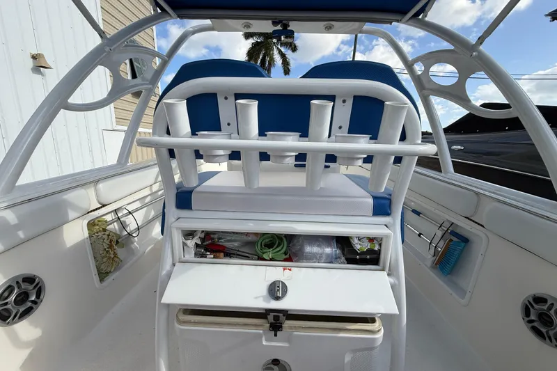 Slide: The Image of 2006 Concept 30 PF Open Fish boat interior with rod holders and storage compartments. - 11