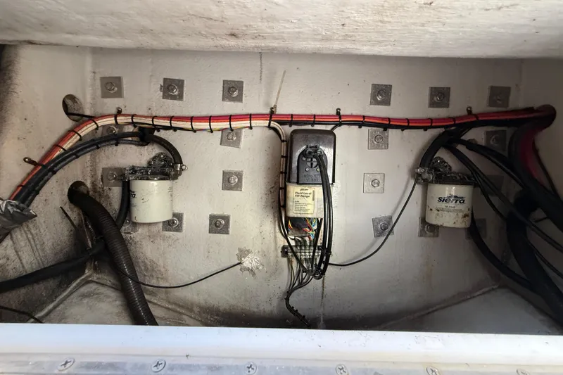 Slide: The Image of Engine compartment of 2006 Concept 30 PF Open Fish boat, showing wiring and filters. - 13