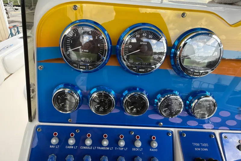 Slide: The Image of Control panel of 2006 Concept 30 PF Open Fish boat with gauges and switches. - 17