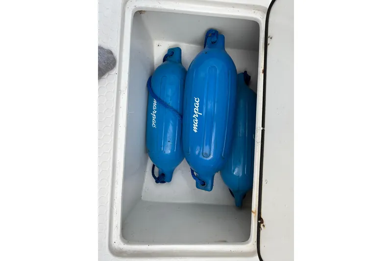 Slide: The Image of Blue boat fenders in storage compartment of 2006 Concept 30 PF Open Fish. - 19
