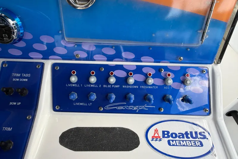 Slide: The Image of Control panel of a 2006 Concept 30 PF Open Fish boat with various switches. - 20