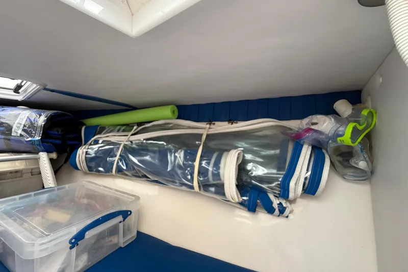 Slide: The Image of Storage compartment in a 2006 Concept 30 PF Open Fish boat with gear and equipment. - 22