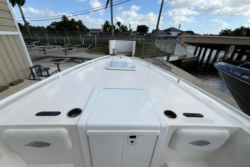 Slide: The Image of 2006 Concept 30 PF Open Fish boat docked near a marina under a partly cloudy sky. - 24