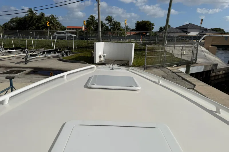 Slide: The Image of 2006 Concept 30 PF Open Fish boat docked near trailers and palm trees. - 26