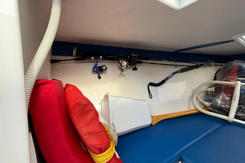 Slide: The Image of Interior of 2006 Concept 30 PF Open Fish boat with fishing gear and life jackets. - 27
