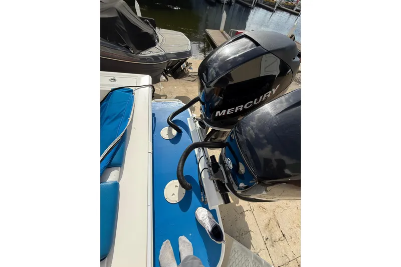 Slide: The Image of 2006 Concept 30 PF Open Fish boat with Mercury outboard engines at dockside. - 8