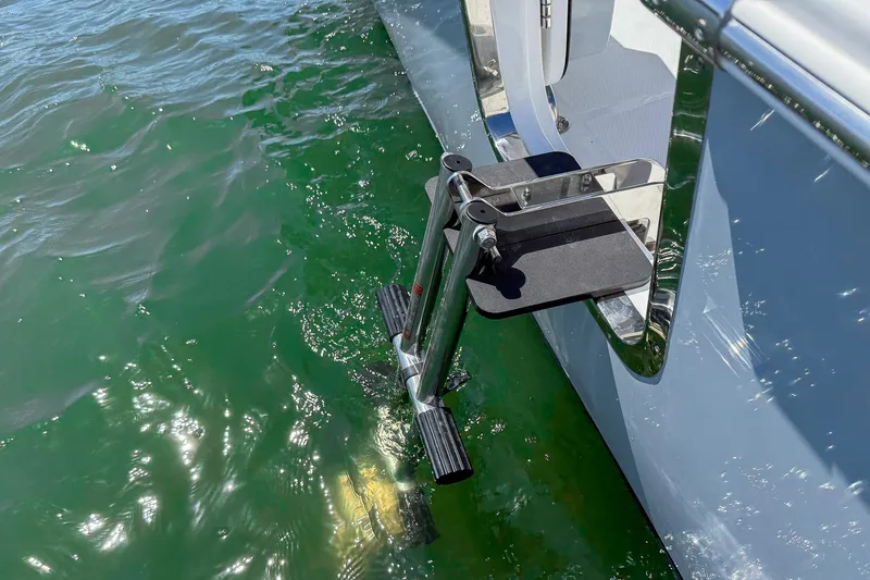 Slide: The Image of Stainless steel swim ladder on 2025 Sea Hunt Ultra 275 SE in green water. - 14