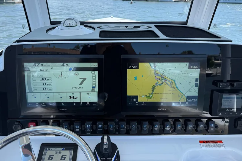 Slide: The Image of Dashboard of 2025 Sea Hunt Ultra 275 SE with Garmin navigation displays. - 20