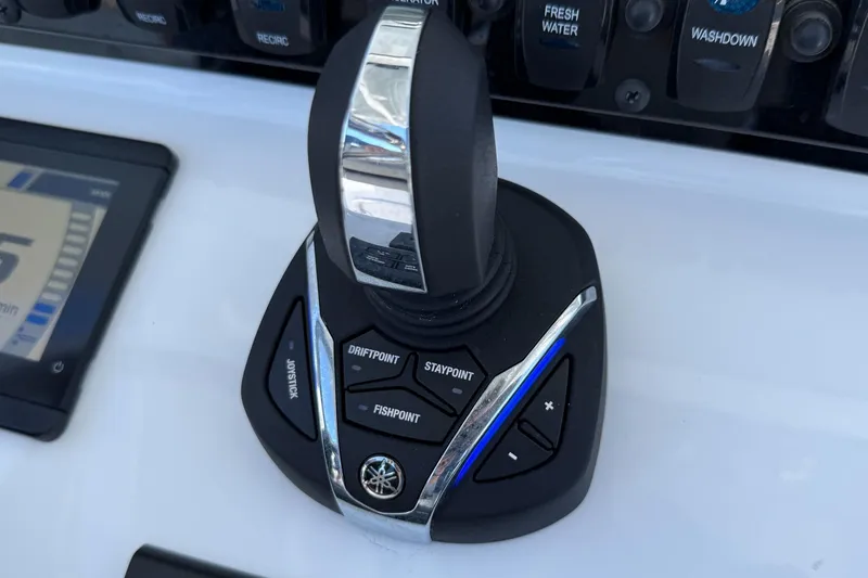 Slide: The Image of Joystick control panel on 2025 Sea Hunt Ultra 275 SE boat dashboard. - 22