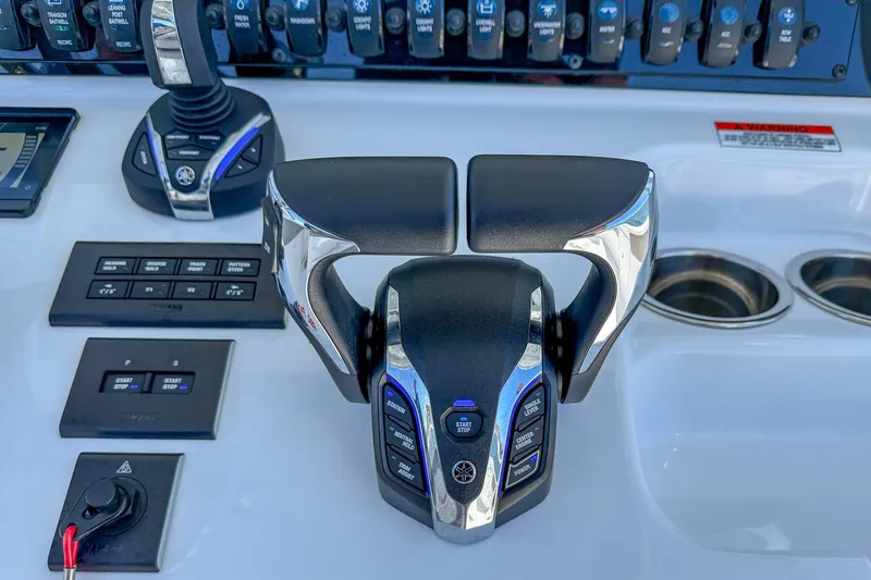 Slide: The Image of Control panel of 2025 Sea Hunt Ultra 275 SE boat with advanced throttle system. - 23