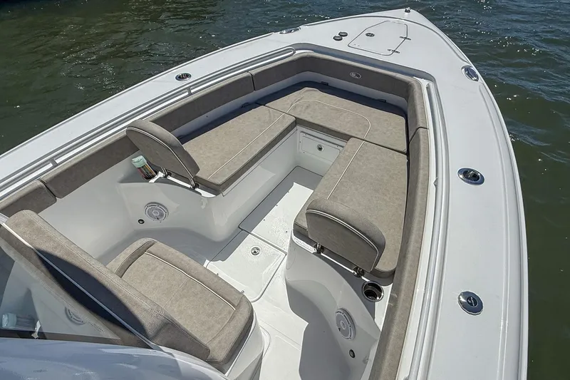 Slide: The Image of 2025 Sea Hunt Ultra 275 SE boat interior with cushioned seating and storage compartments. - 32
