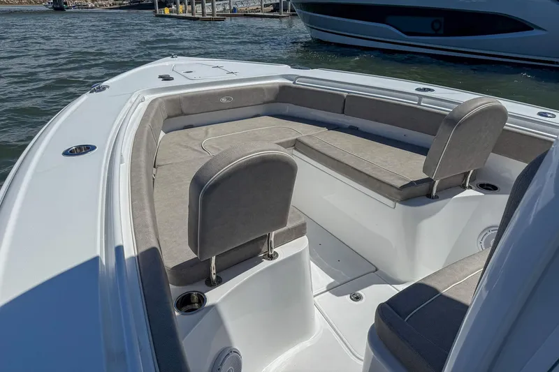 Slide: The Image of 2025 Sea Hunt Ultra 275 SE boat interior with cushioned seating and sleek design. - 33