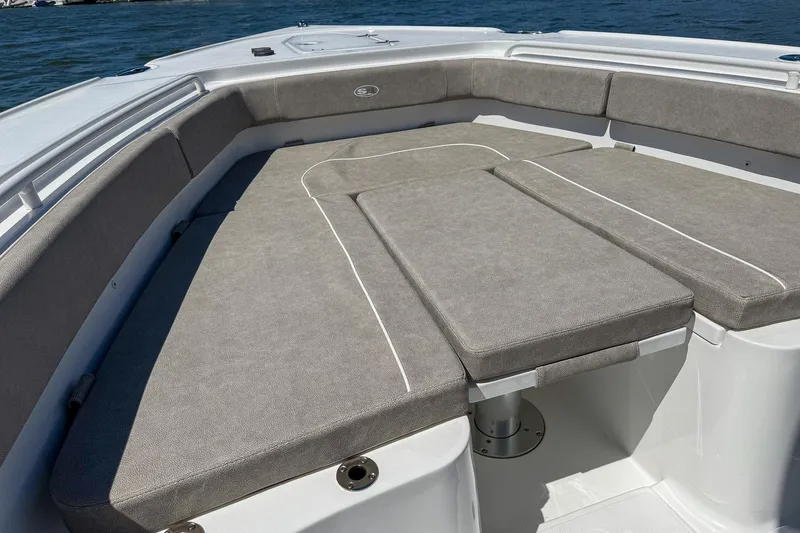 Slide: The Image of 2025 Sea Hunt Ultra 275 SE boat with spacious cushioned seating area. - 36