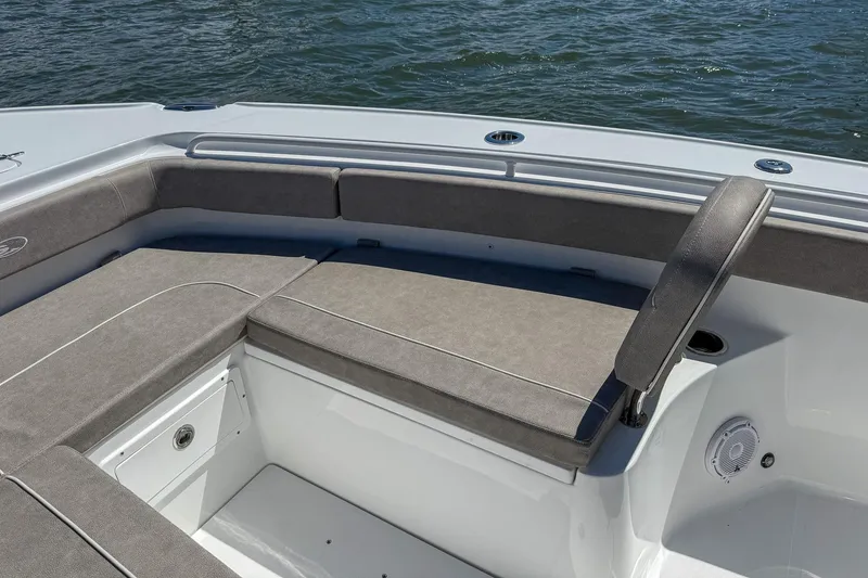 Slide: The Image of 2025 Sea Hunt Ultra 275 SE boat interior with cushioned seating and ocean view. - 39