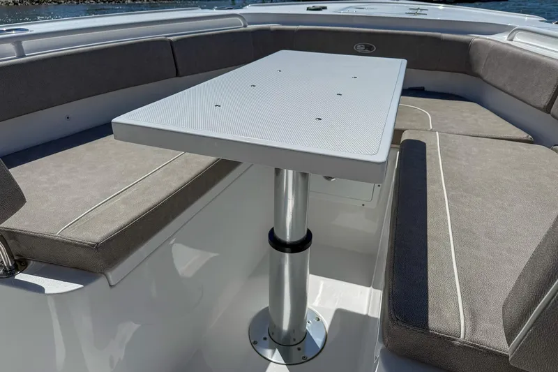 Slide: The Image of Interior seating area of 2025 Sea Hunt Ultra 275 SE boat with table. - 40