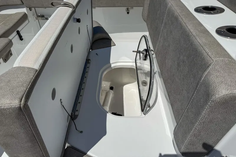 Slide: The Image of 2025 Sea Hunt Ultra 275 SE boat interior with open storage compartment and seating. - 41