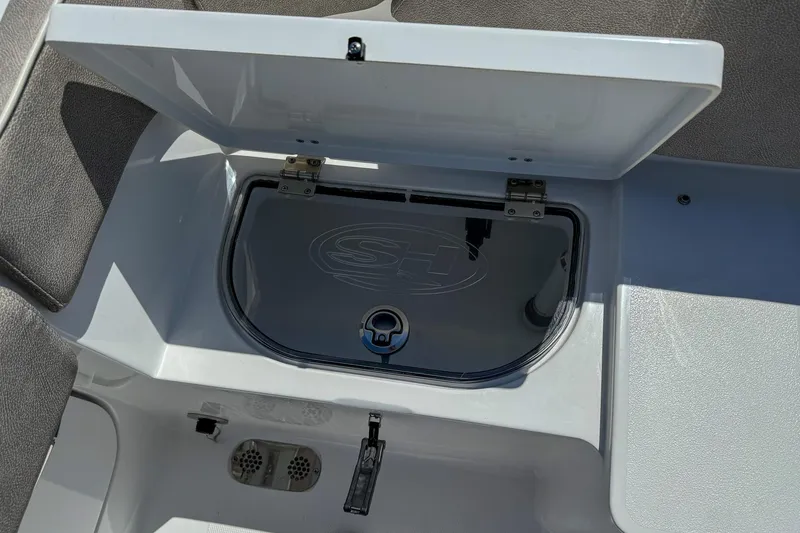 Slide: The Image of Open storage compartment on 2025 Sea Hunt Ultra 275 SE boat. - 42