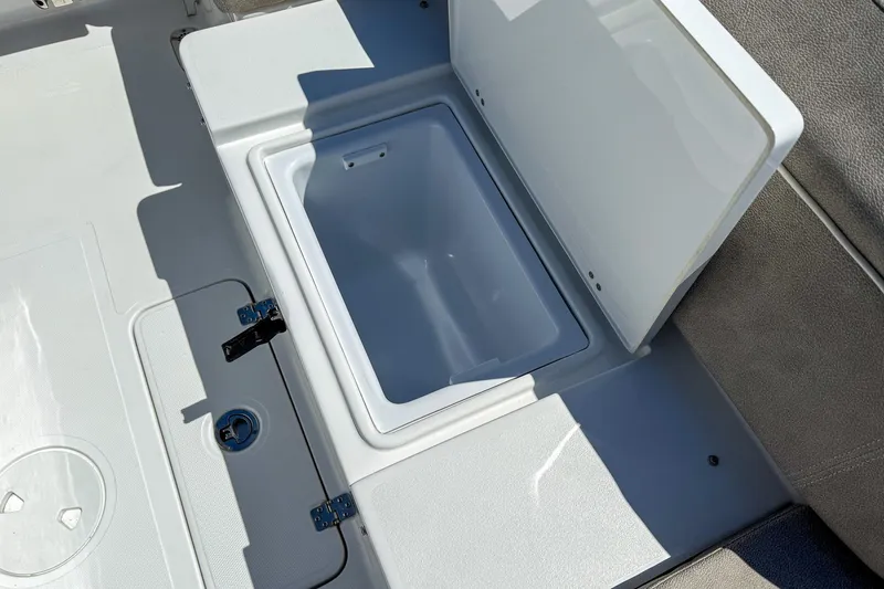 Slide: The Image of Open storage compartment on 2025 Sea Hunt Ultra 275 SE boat deck. - 43