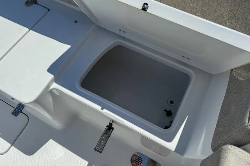 Slide: The Image of Open storage compartment on 2025 Sea Hunt Ultra 275 SE boat. - 44