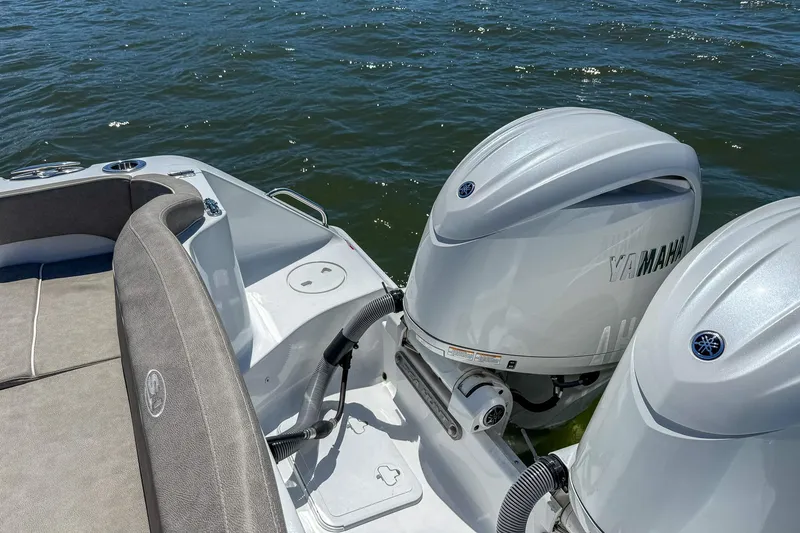 Slide: The Image of 2025 Sea Hunt Ultra 275 SE boat with Yamaha outboard engines on water. - 49