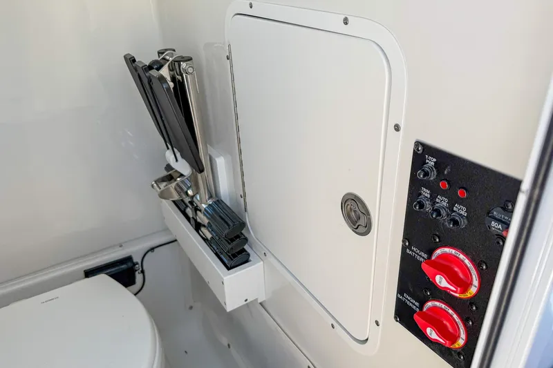 Slide: The Image of Interior of 2025 Sea Hunt Ultra 275 SE boat, featuring control panel and storage area. - 51