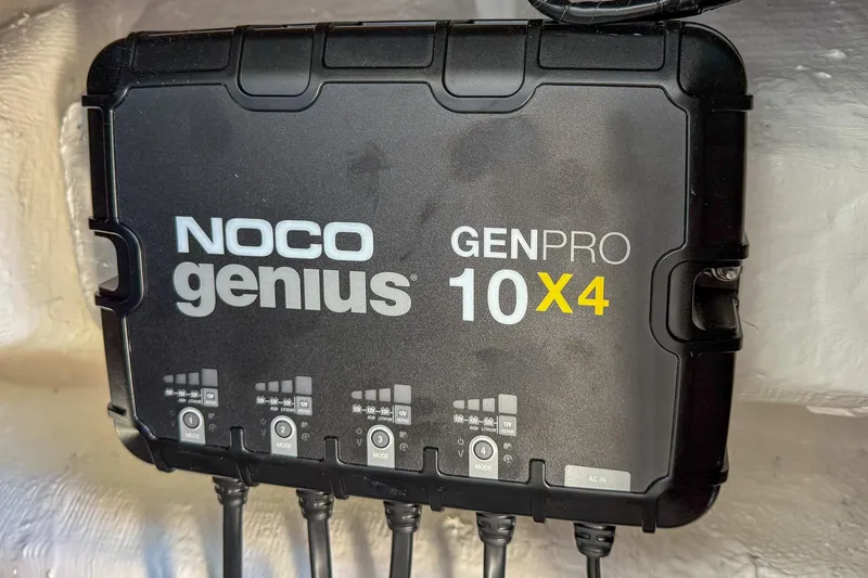 Slide: The Image of NOCO Genius GENPRO 10X4 charger installed on 2025 Sea Hunt Ultra 275 SE boat. - 52