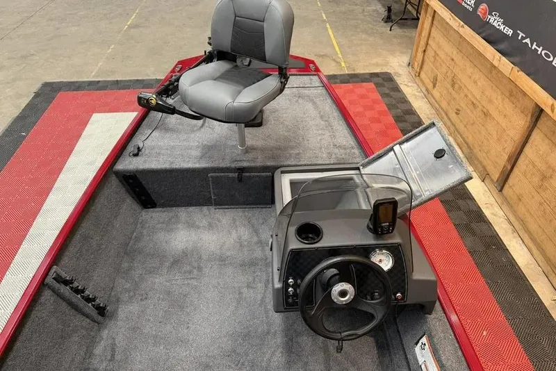 Slide: The Image of 2026 Tracker Bass Tracker Classic XL boat interior with steering console and seating. - 4