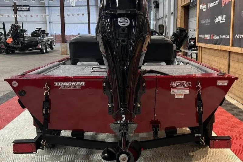 Slide: The Image of 2026 Tracker Bass Tracker Classic XL boat, rear view in showroom setting. - 5