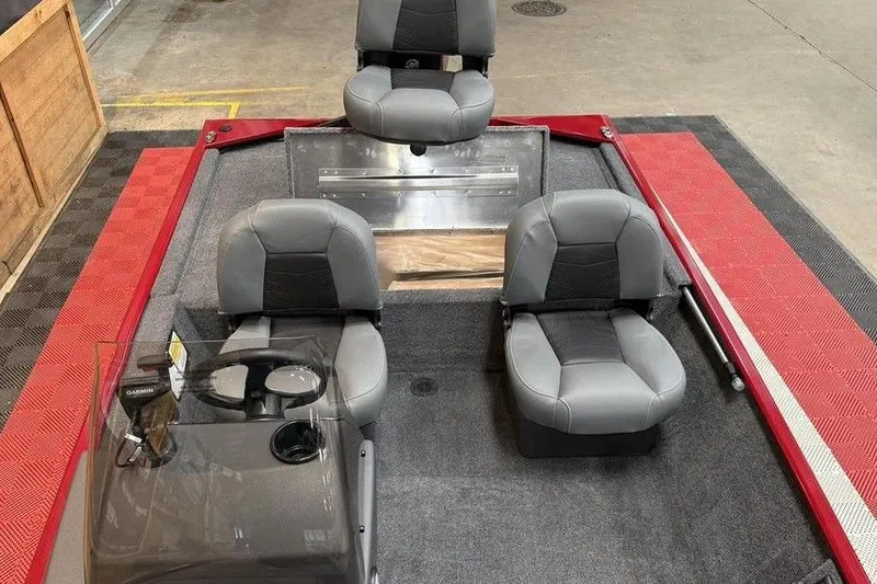 Slide: The Image of 2026 Tracker Bass Tracker Classic XL boat interior with three gray seats and steering console. - 6