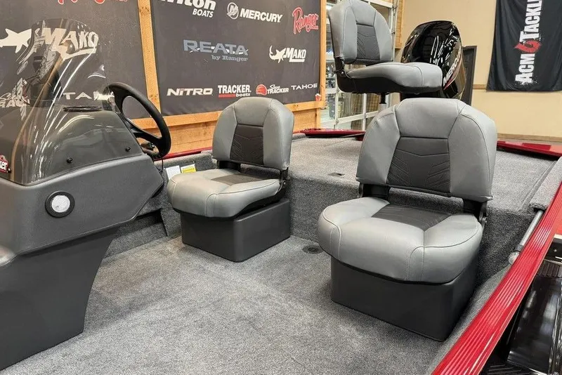 Slide: The Image of 2026 Tracker Bass Tracker Classic XL boat interior with gray seating and steering console. - 8