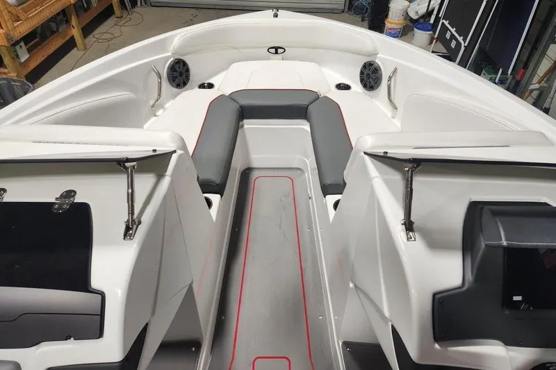 Slide: The Image of 2026 Tahoe 210 S boat interior with seating and storage compartments. - 11