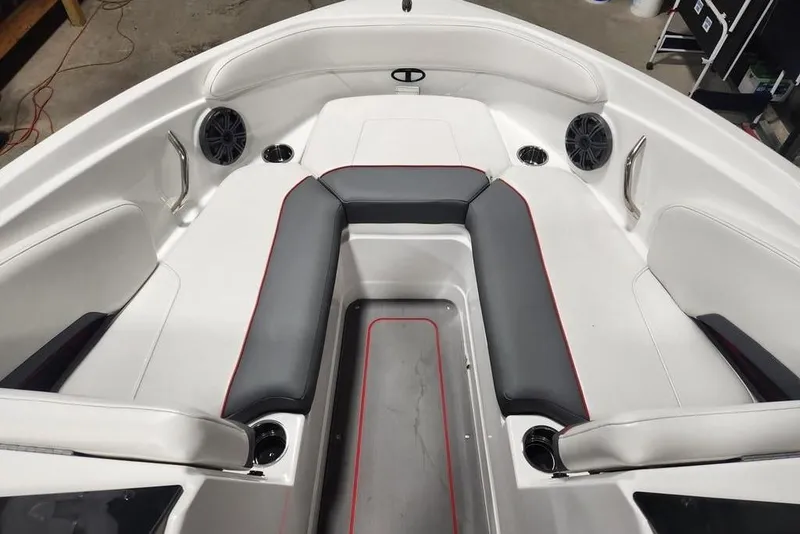 Slide: The Image of 2026 Tahoe 210 S boat interior with sleek seating and built-in speakers. - 13