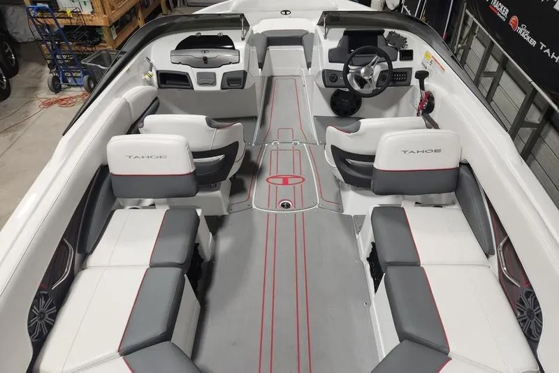 Slide: The Image of Interior view of 2026 Tahoe 210 S boat with modern seating and steering console. - 4