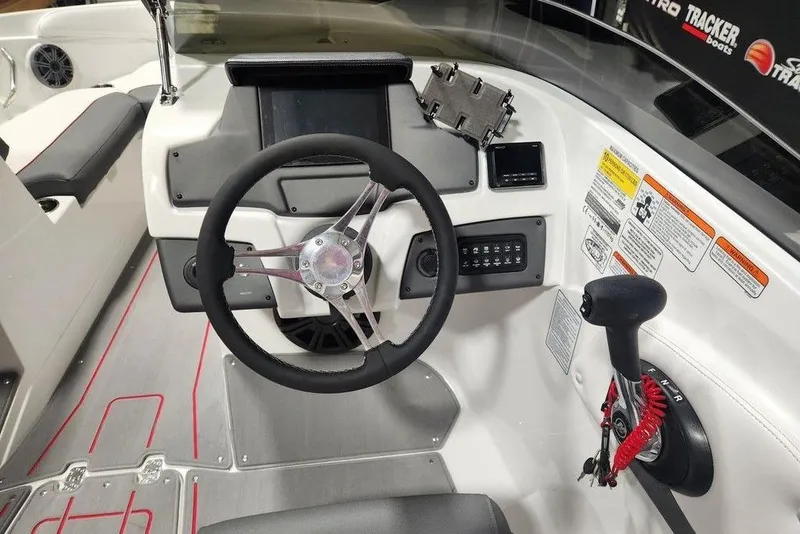 Slide: The Image of Steering console of 2026 Tahoe 210 S boat with modern controls and sleek design. - 5