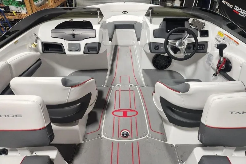 Slide: The Image of Interior view of 2026 Tahoe 210 S boat, featuring modern seating and steering console. - 6
