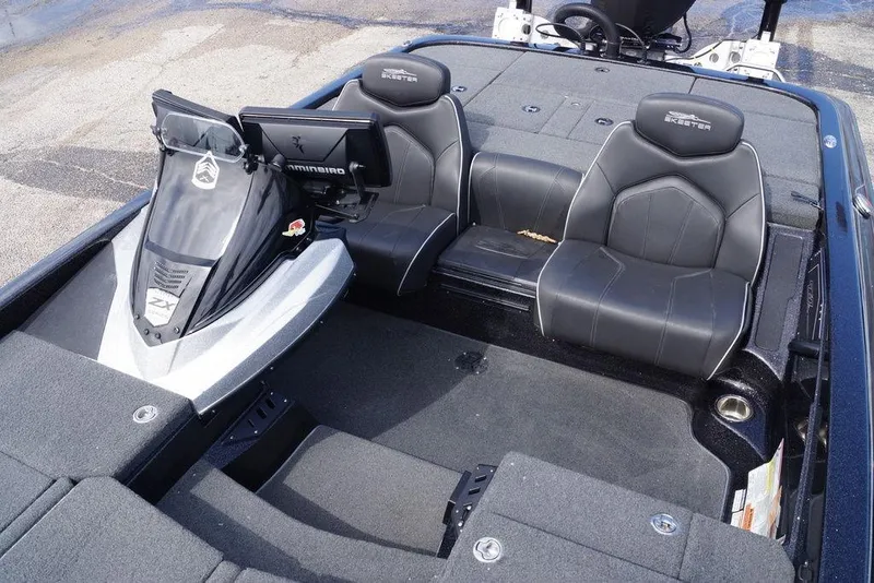 Slide: The Image of 2022 Skeeter ZX225 boat interior with dual seats and advanced navigation system. - 10