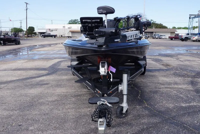 Slide: The Image of 2022 Skeeter ZX225 boat on trailer in parking lot, front view. - 12